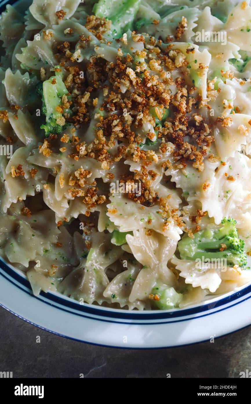 Creamy Italian alfredo bowtie pasta with broccoli Stock Photo Alamy