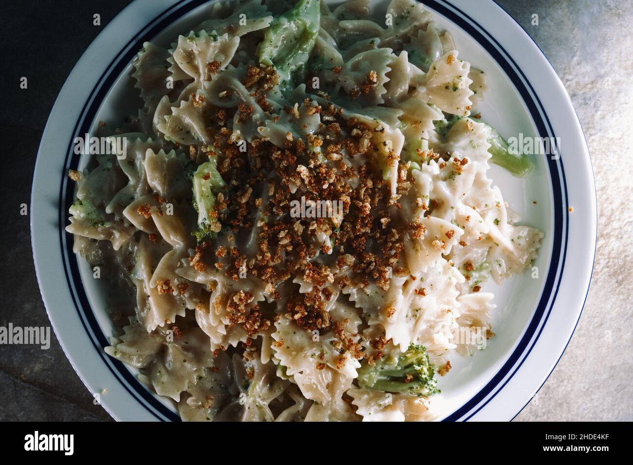 Creamy Italian alfredo bowtie pasta with broccoli Stock Photo Alamy