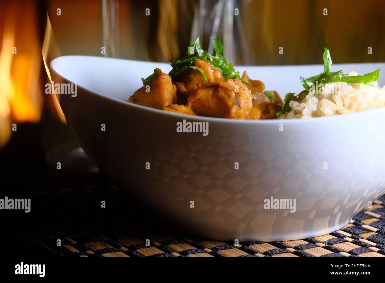 Hungarian chicken paprikash with brown rice and parsley garnish Stock