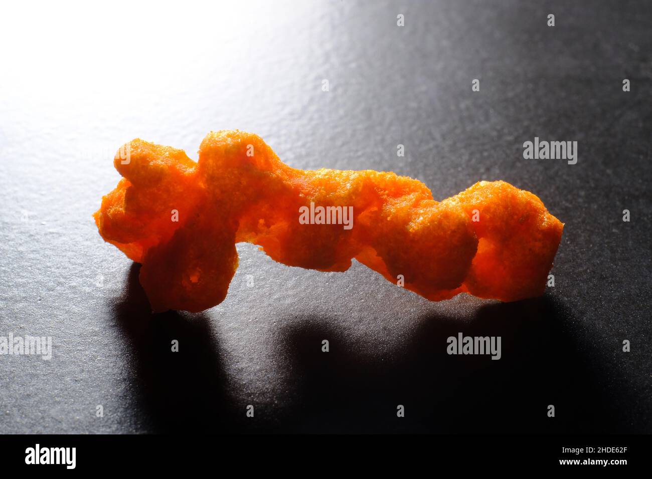 Cheese puff unhealthy junk food snack macro closeup Stock Photo Alamy