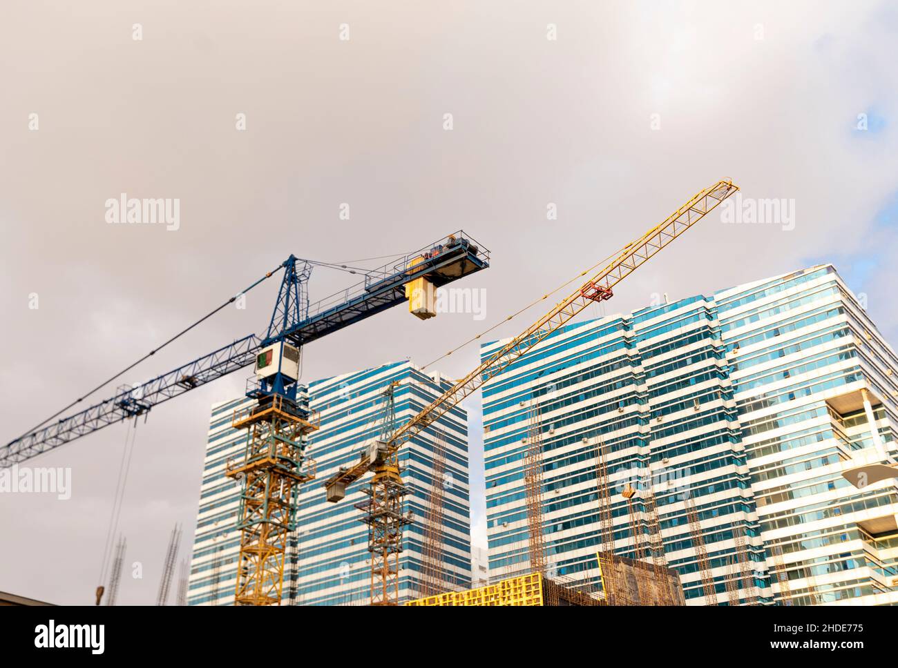 Construction site, cranes,Emerald Towers real estate modern complex, designed by architect Roy Varacalli, Astana, Nur-Sultan, Kazakhstan, Central Asia Stock Photo
