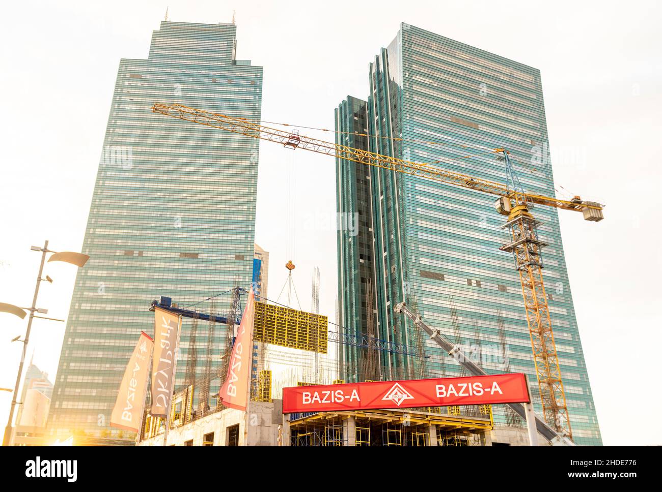Construction site, cranes,Emerald Towers real estate modern complex, designed by architect Roy Varacalli, Astana, Nur-Sultan, Kazakhstan, Central Asia Stock Photo