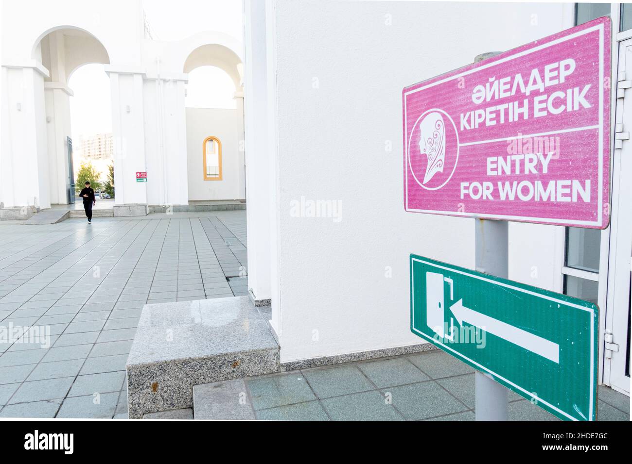 Directional sign showing the entrance only for women in English and Kazakh, entryway to the Mosque in Astana, Nur-Sultan, Kazakhstan, Central Asia Stock Photo