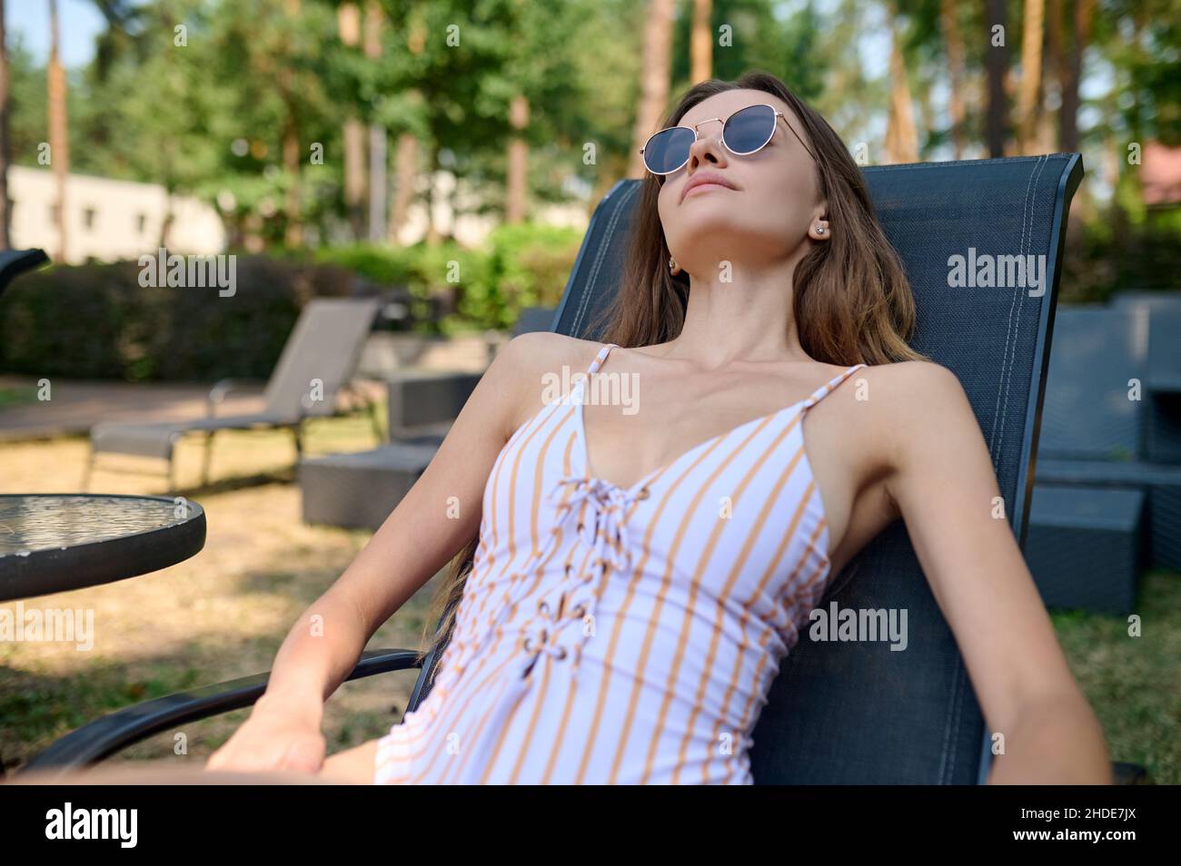 Woman sunglasses lying relaxed hi-res stock photography and images - Alamy