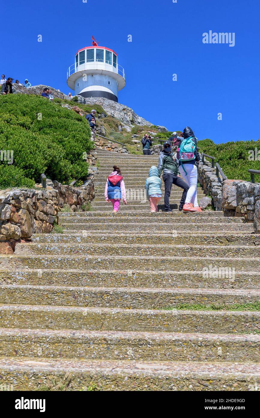 CAPE POINT, SOUTH AFRICA - DEC 23, 2021: Steps leading to the old lighthouse at Cape Point in the Table Mountain National Park. People are visible Stock Photo