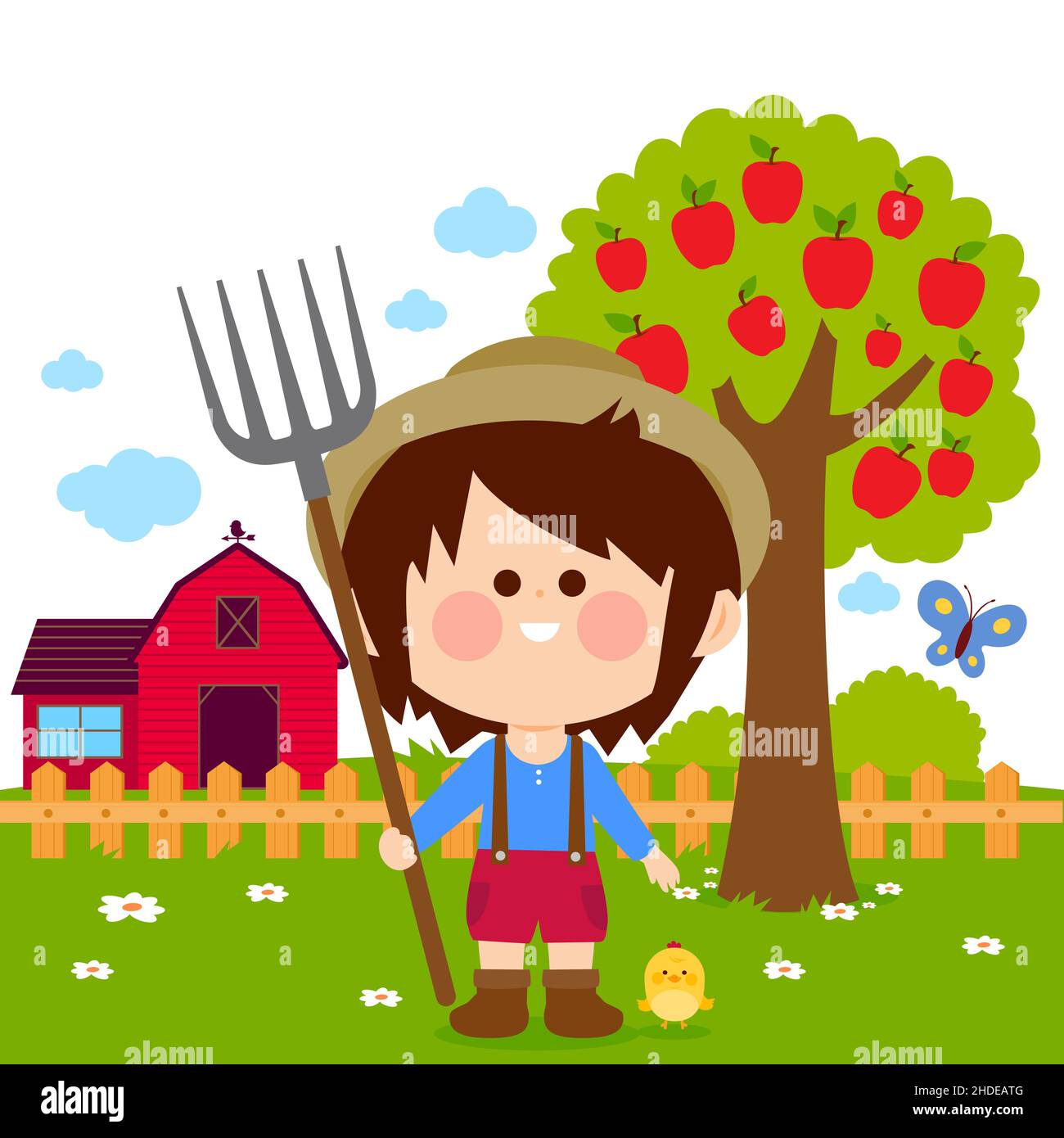 Little farmer boy at the farm with barn, farmhouse, fence and apple tree. Stock Photo