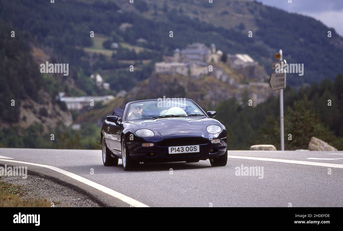 Road trip along Route Des Grandes Alpes France in a 1996 Aston Martin DB7 Volante. Stock Photo