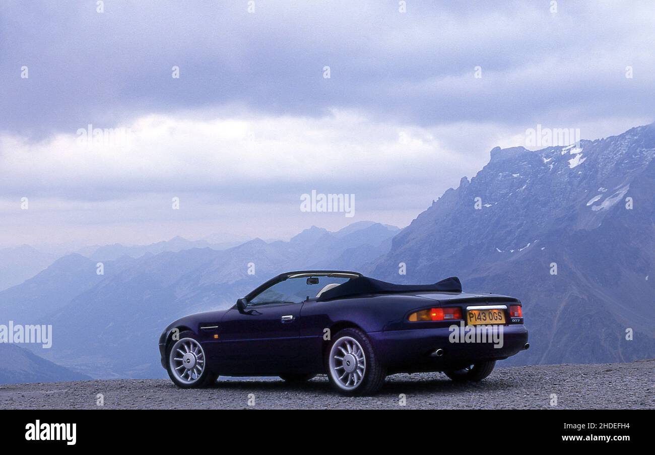 Road trip along Route Des Grandes Alpes, car driving on the Col Du Galibier  France in a 1996 Aston Martin DB7 Volante Stock Photo - Alamy
