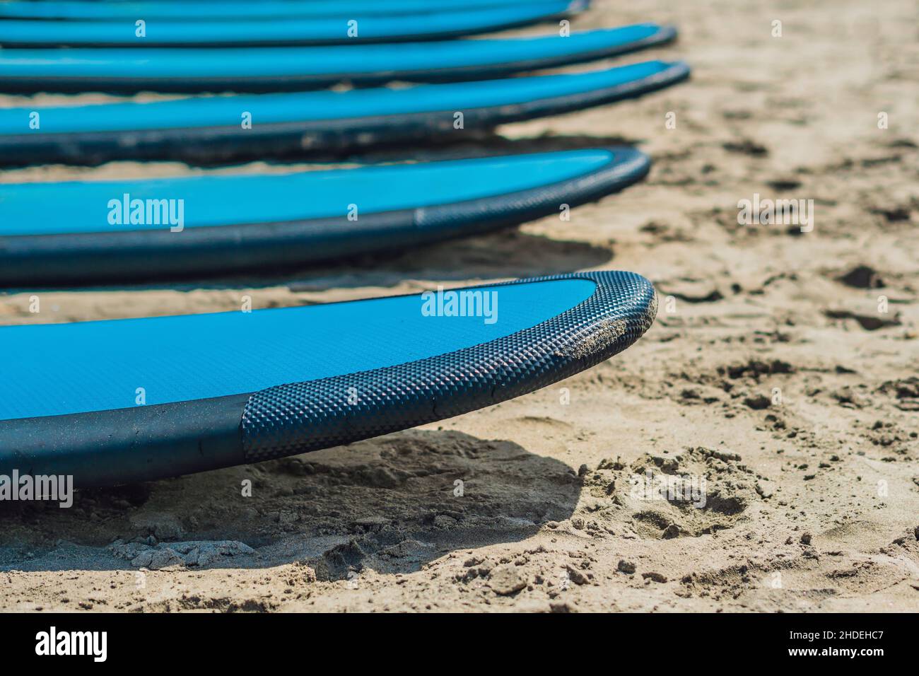 Blue surfboards in the sand on the beach Stock Photo Alamy