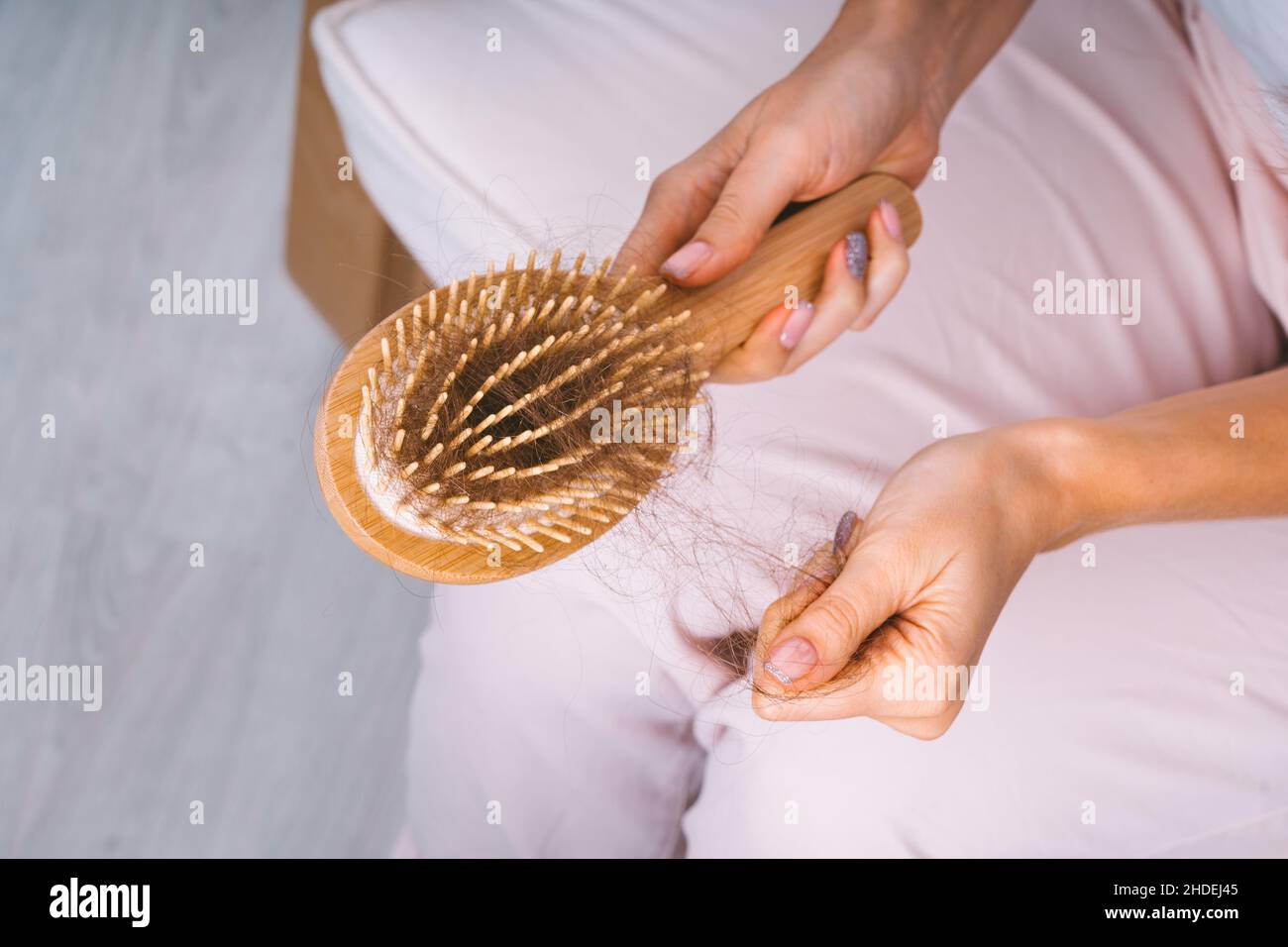 Woman hair falling out hairbrush hires stock photography and images