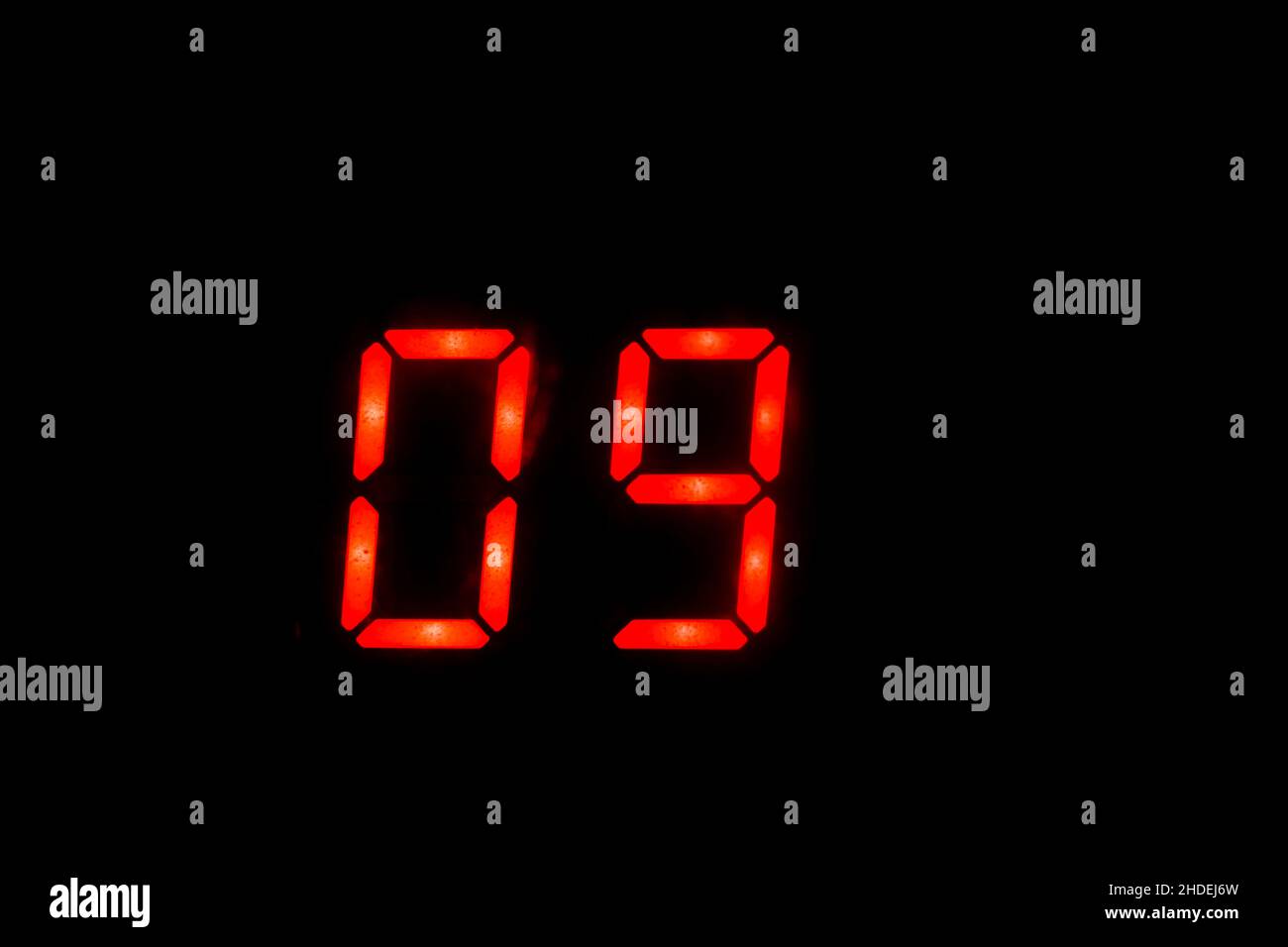 Old digital clock red number on black background Stock Photo Alamy
