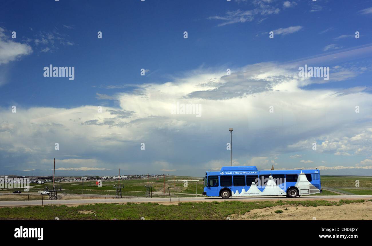 Shuttle bus heading past the runway at Denver International Airport in June Stock Photo