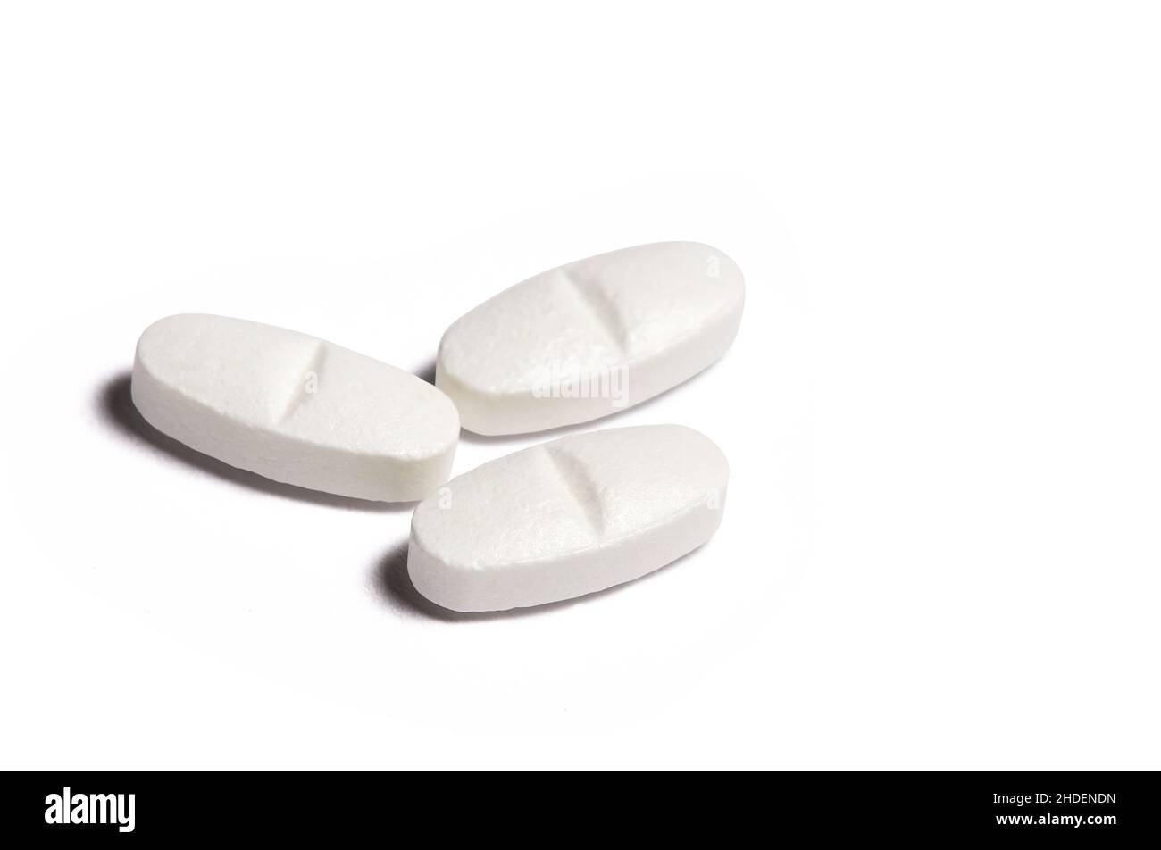 White pills on the white background. Health care concept Stock Photo