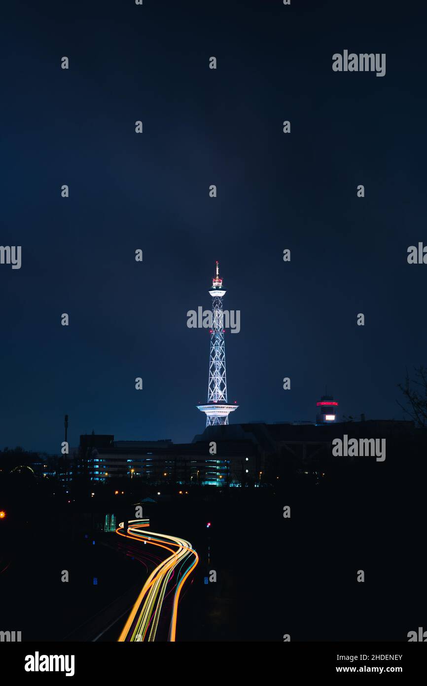 Vertical shot of a Funkturm tower at night in Berlin, Germany Stock Photo