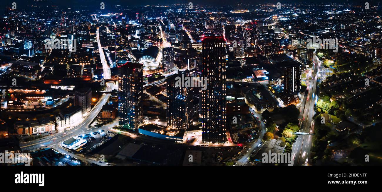 Panorama view of modern buildings and skyscrapers at night Stock Photo ...
