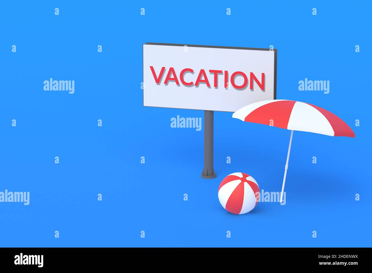 Beach umbrella and ball near billboard with word vacation. Advertising of a travel company, resort. Reservation of places in the hotel. Tourist journe Stock Photo