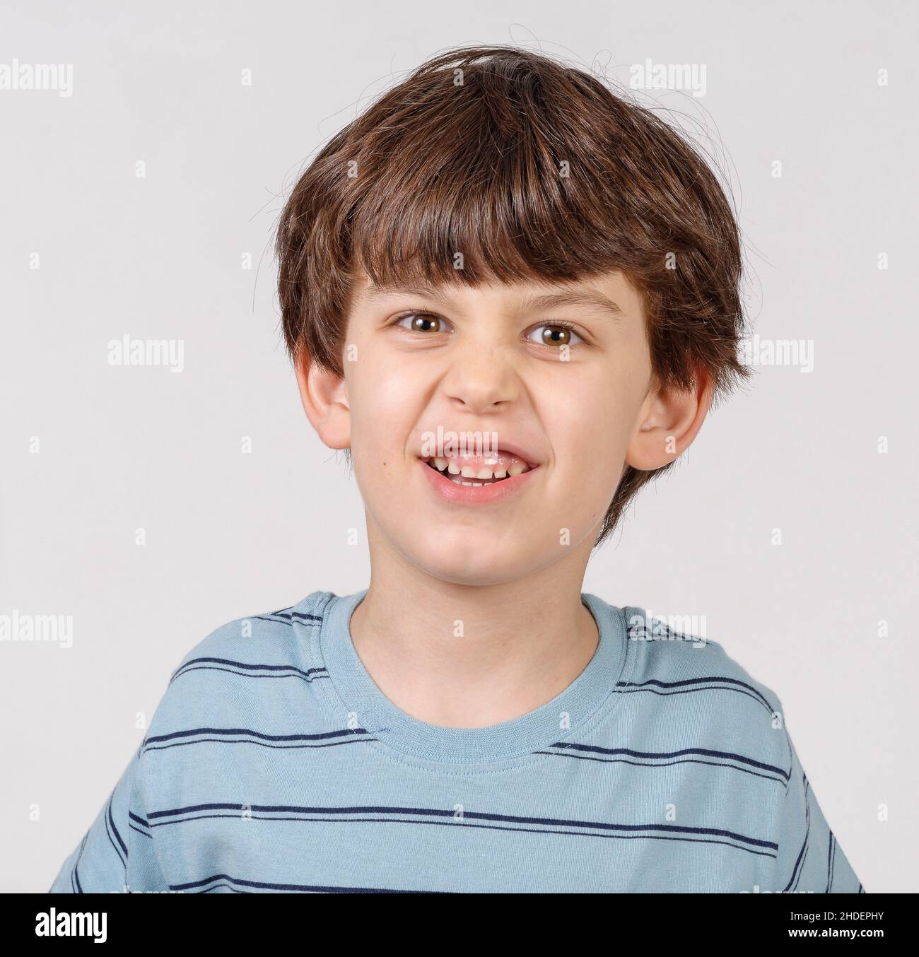 Young boy of six pulling faces Model releases Stock Photo