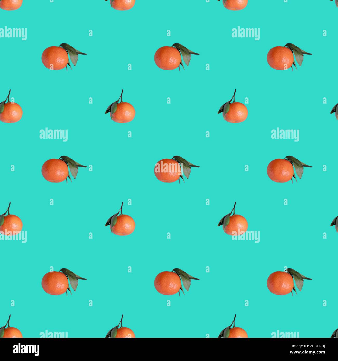 Seamless pattern with ripe orange tangerines on turquoise background Stock Photo