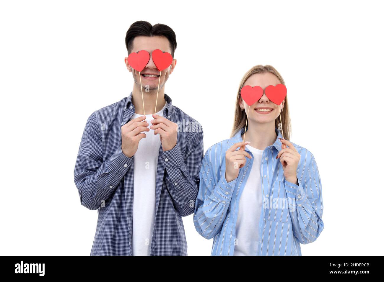 Cute couple with hearts isolated on white background Stock Photo - Alamy