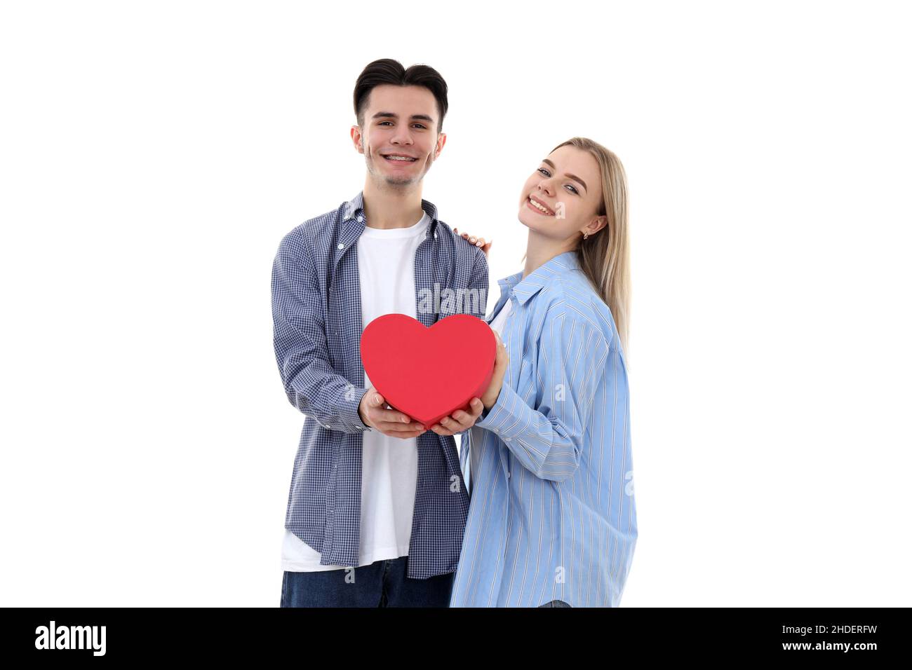 Cute couple with heart isolated on white background Stock Photo - Alamy