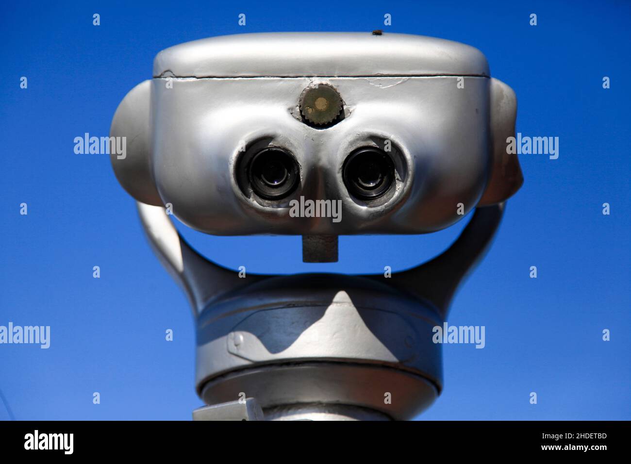 coin operated Viewing telescope aimed at a blue sky Stock Photo