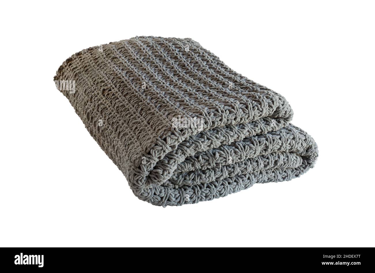 Isolated warm woven knit gray blanket folded over a white background with clipping path. Stock Photo