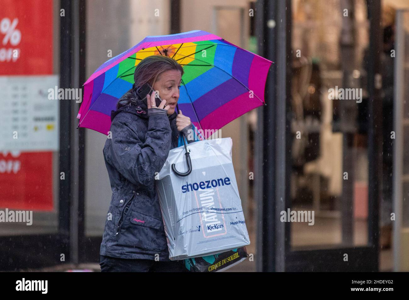 Southport, Merseyside.  UK Weather. 6 Jan 2022. Rain, sleet and snow on a cold day for shoppers in the town centre as temperature drops .  Credit; MediaWorld/Images/AlamyLiveNews Stock Photo