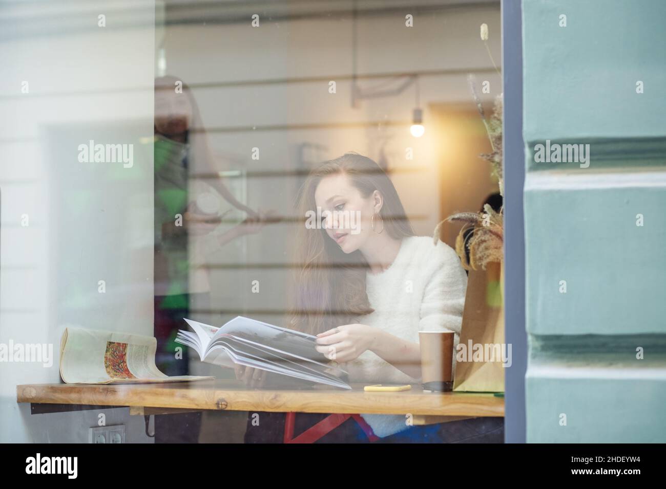 Hot drink. Student is studying homework. Horizontal. Stock Photo