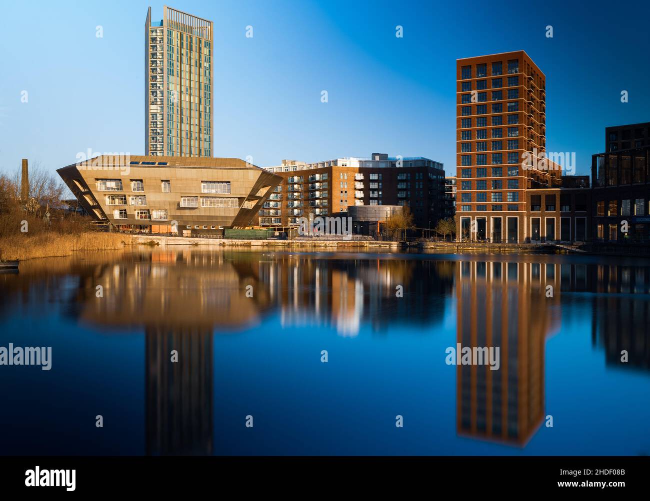 Canada Water Library, South London reflected in the lake at Surrey Quays by CZWG architects Stock Photo