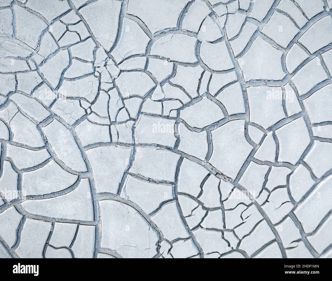 Cracked white clay on dried lakebed, natural pattern Stock Photo