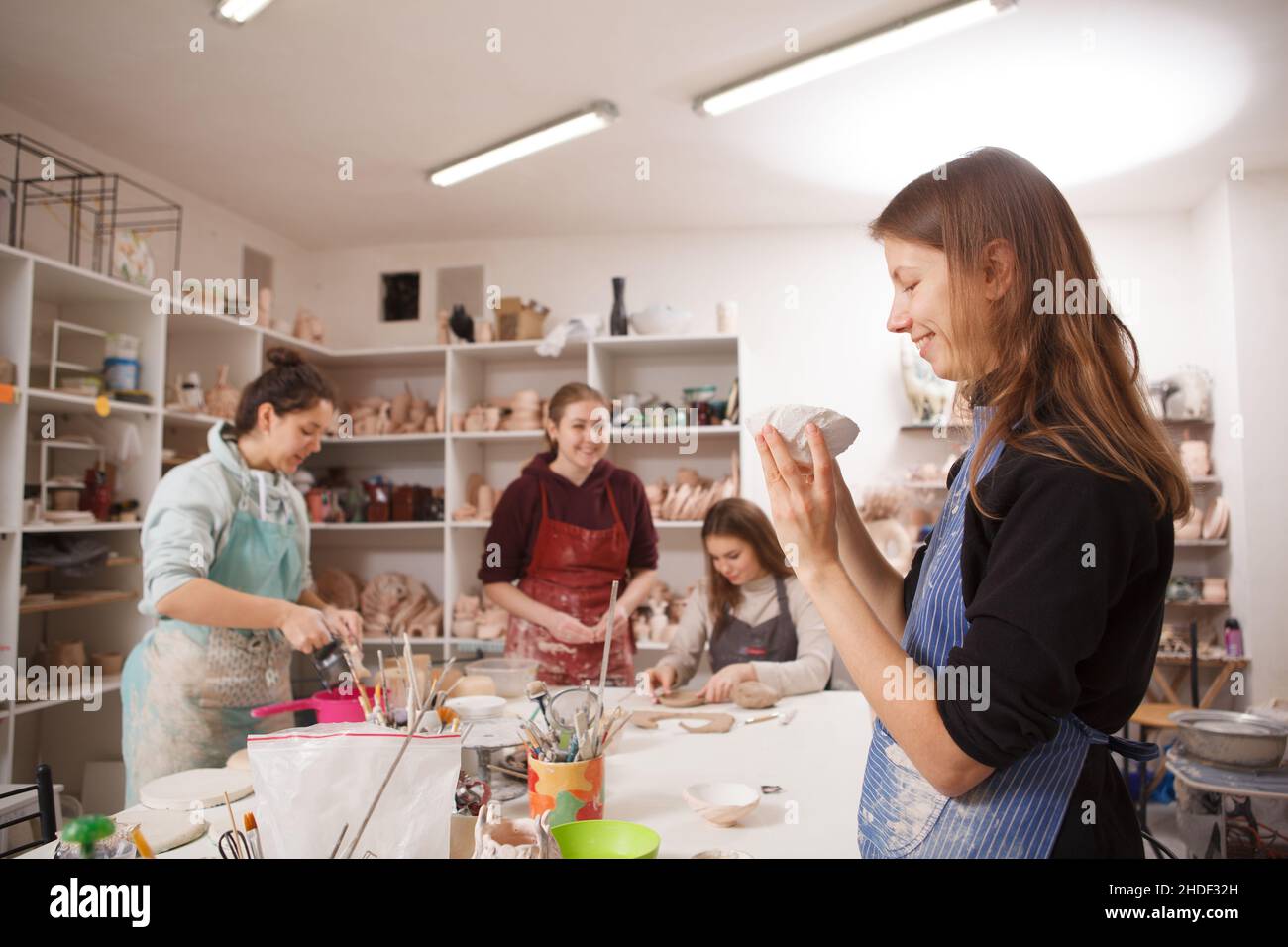 Female ceramists enjoying working at their workshop Stock Photo - Alamy