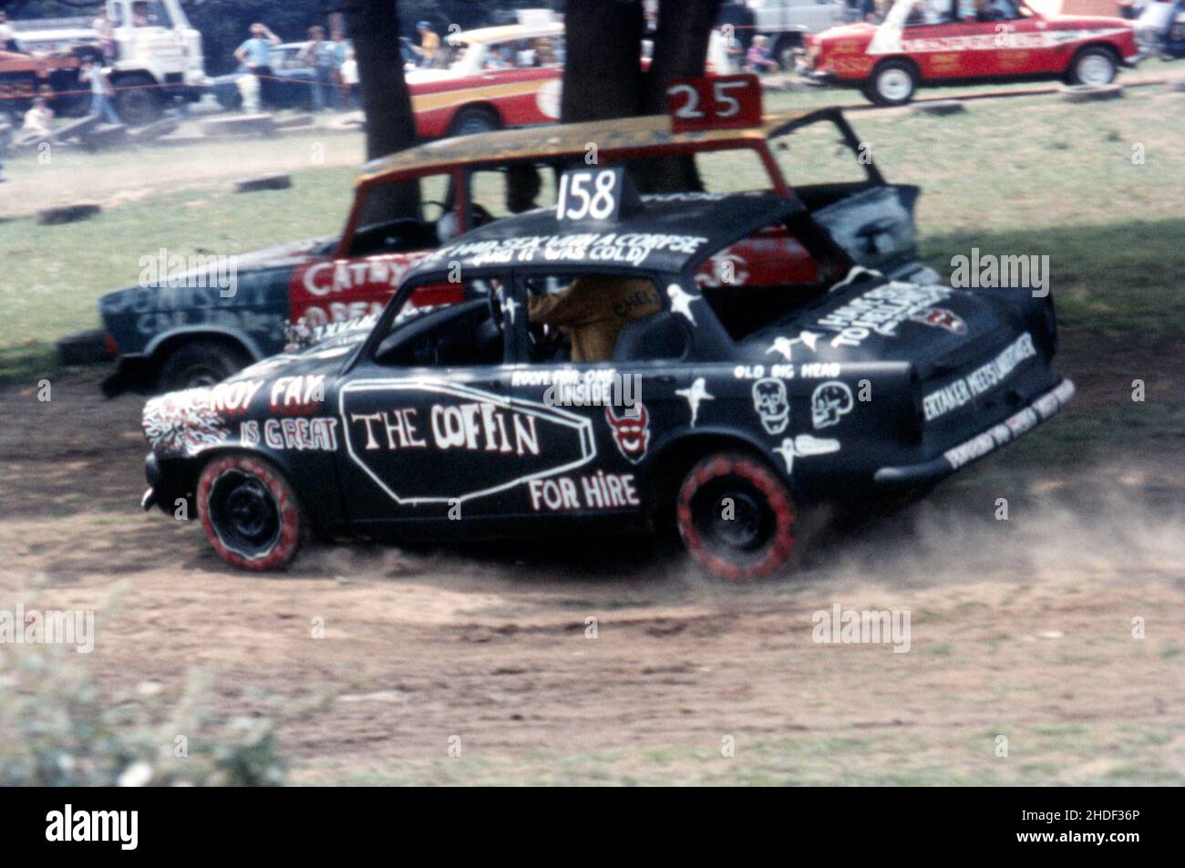 Banger racing featuring colourful painted cars with names like the Coffin. 1970s, motor sport Stock Photo