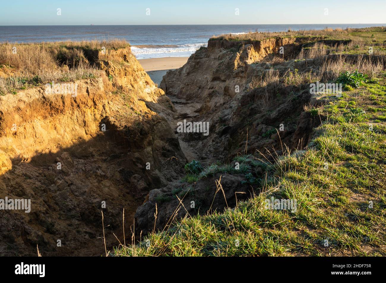East Coast erosion at Happisburgh beach cliffs due to high spring tides ...