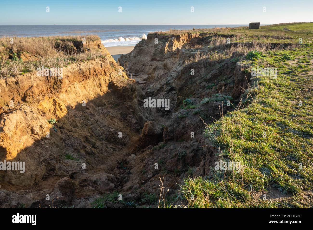 East Coast erosion at Happisburgh beach cliffs due to high spring tides ...