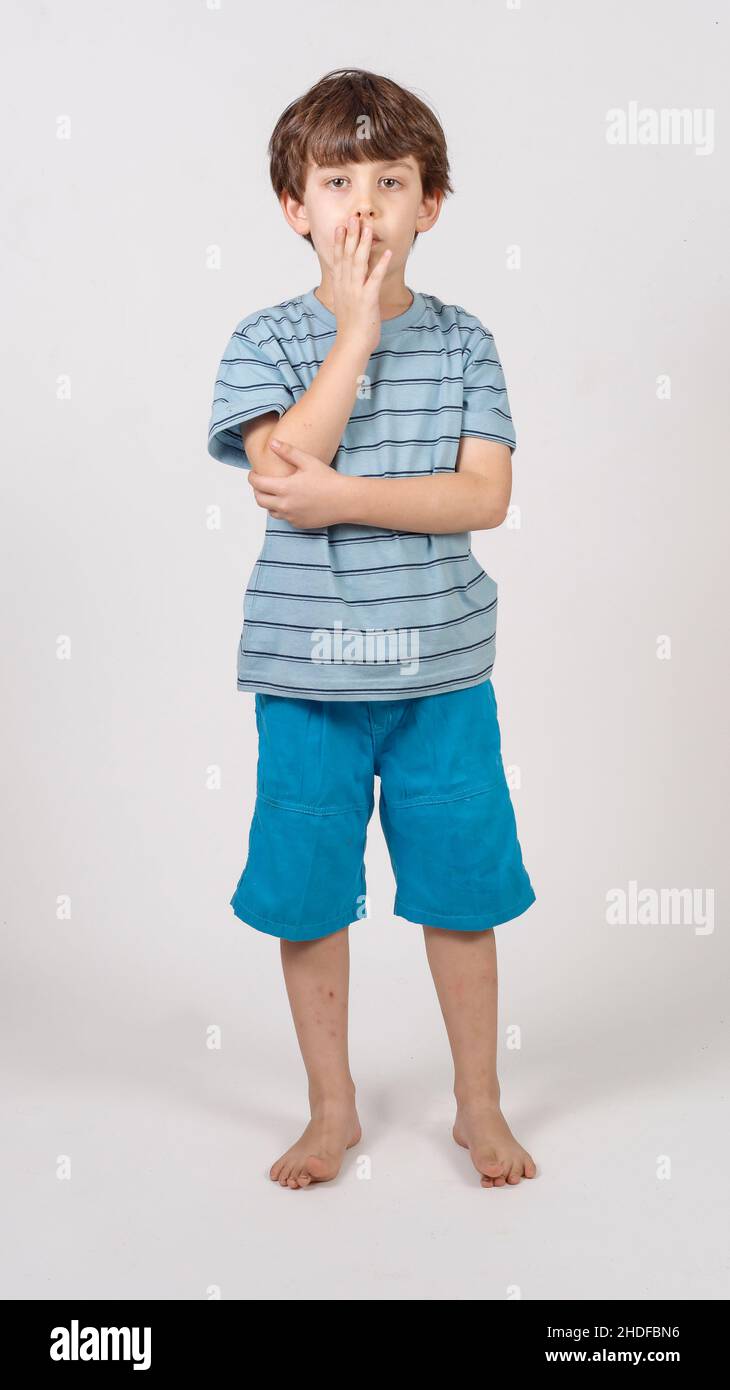 Young philosophical boy of six in deep thought Stock Photo