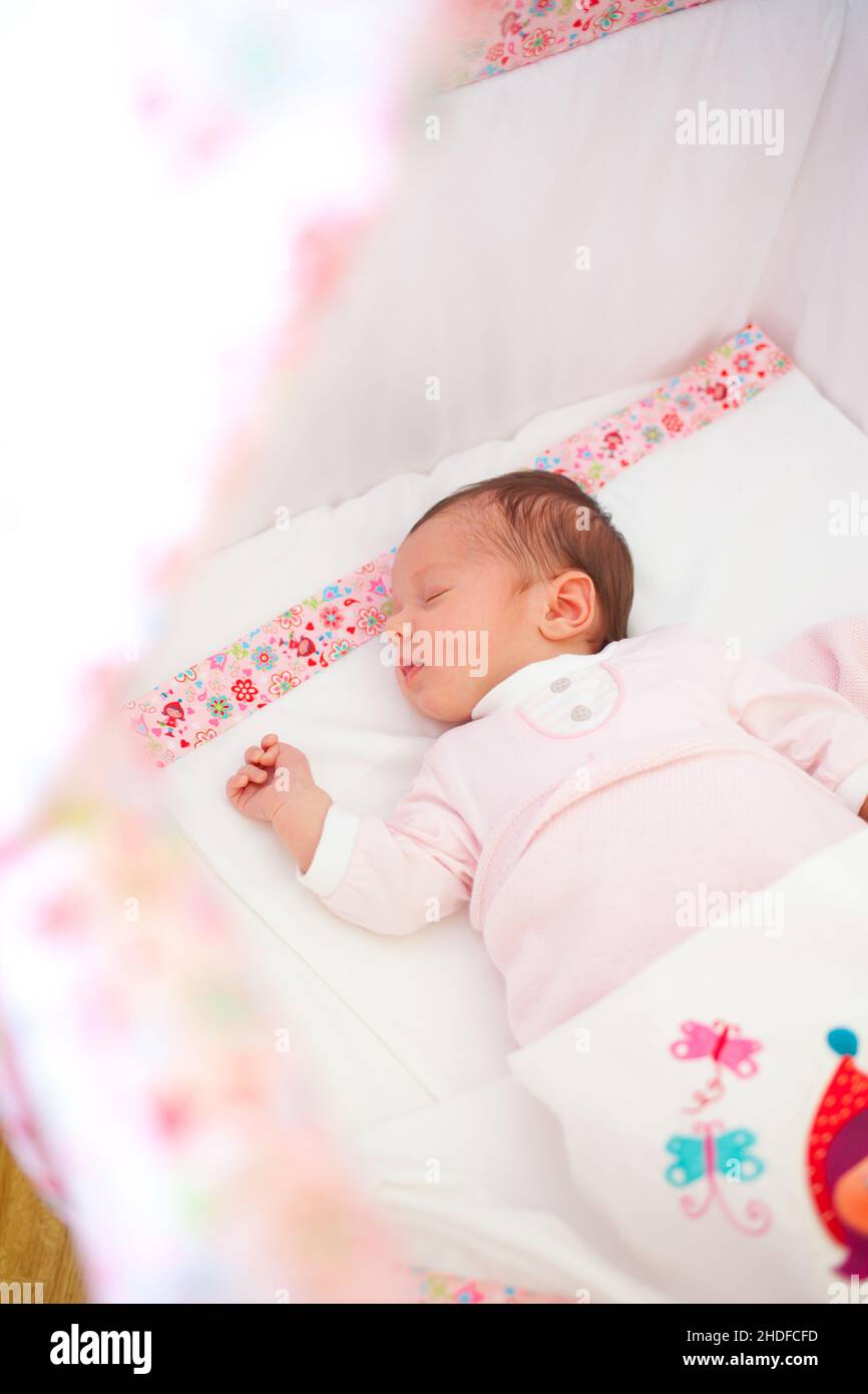 Baby girl sleeping cot hi-res stock photography and images - Alamy