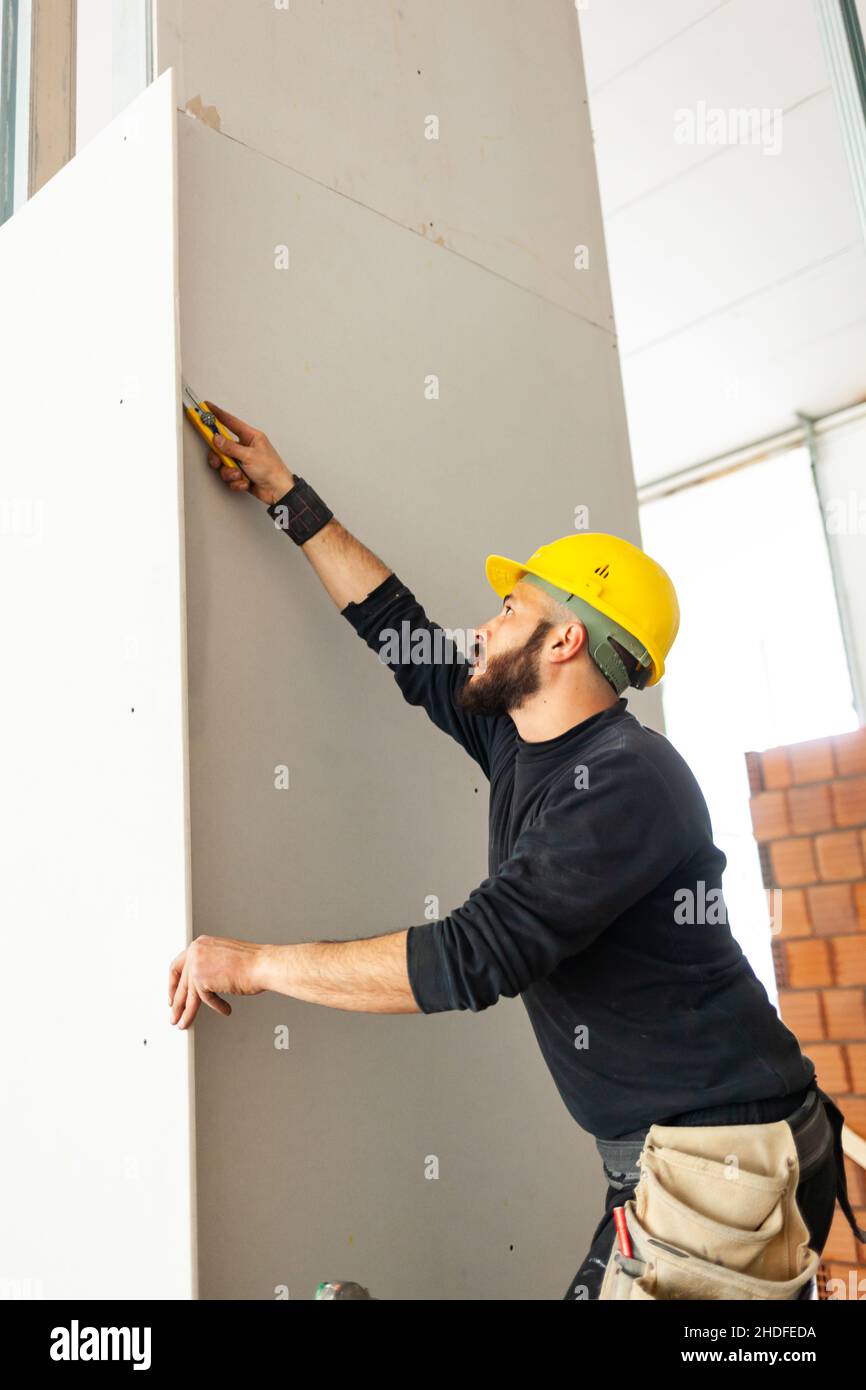 construction worker, cutting, plasterboard, blue collar, builder