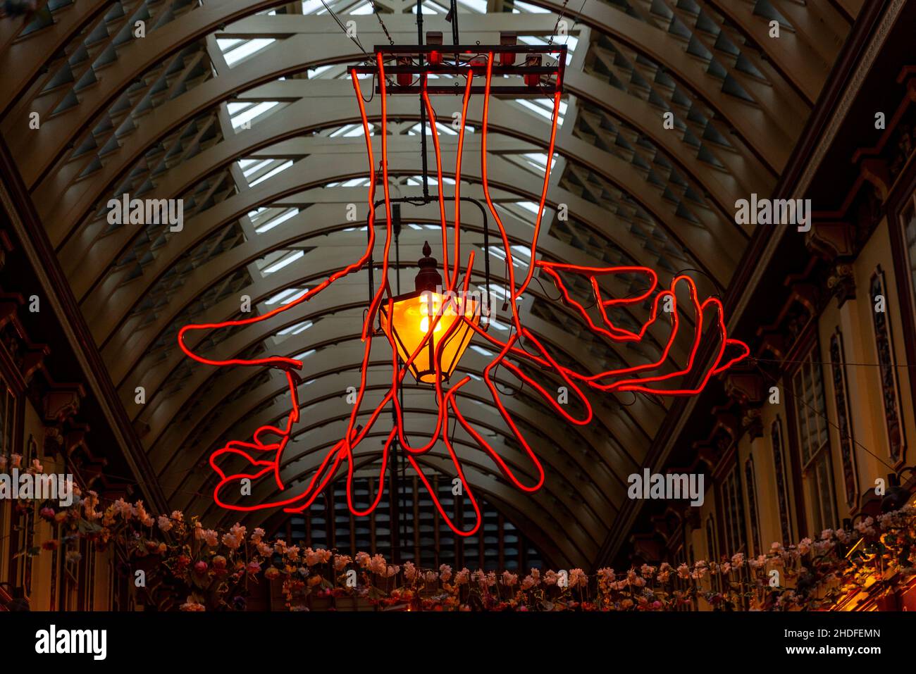 Leadenhall market ceiling with The Source by Patrick Tuttofuoco, neon hands showing sign language, The City, London Stock Photo