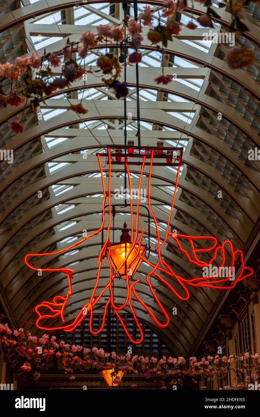 Leadenhall market ceiling with The Source by Patrick Tuttofuoco, neon hands showing sign language, The City, London Stock Photo