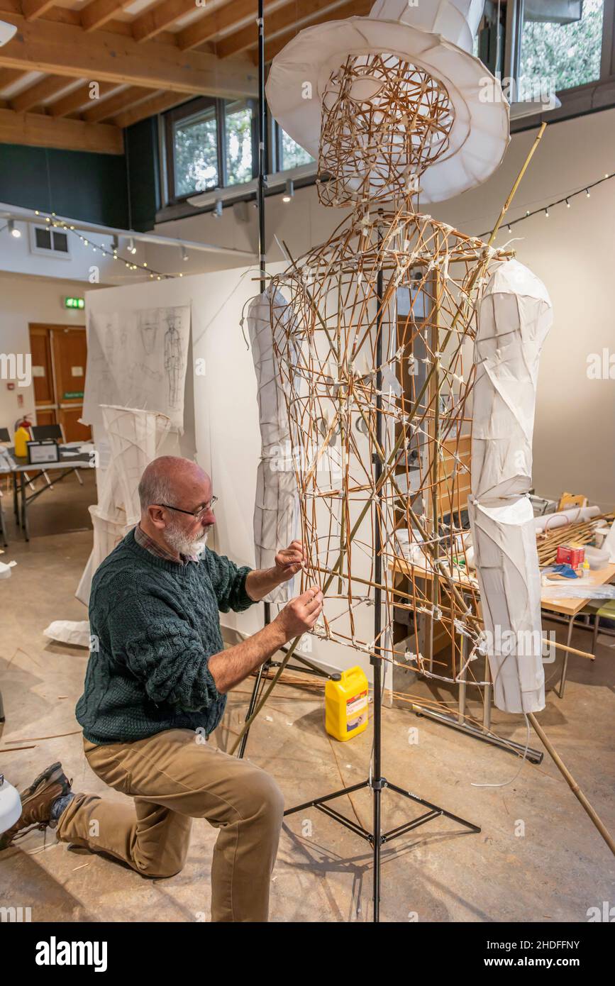 Lantern maker Anthony Crosby creating a large paper and withy sculpture to be displayed in the Trebah Garden of Light in Cornwall UK. Stock Photo
