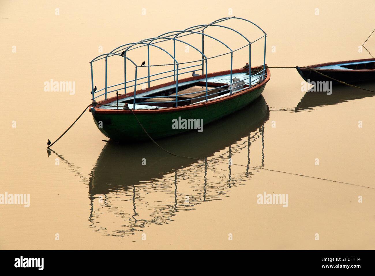image of tourist boat reflection over ganga river at varanasi uttar pradesh india. Stock Photo