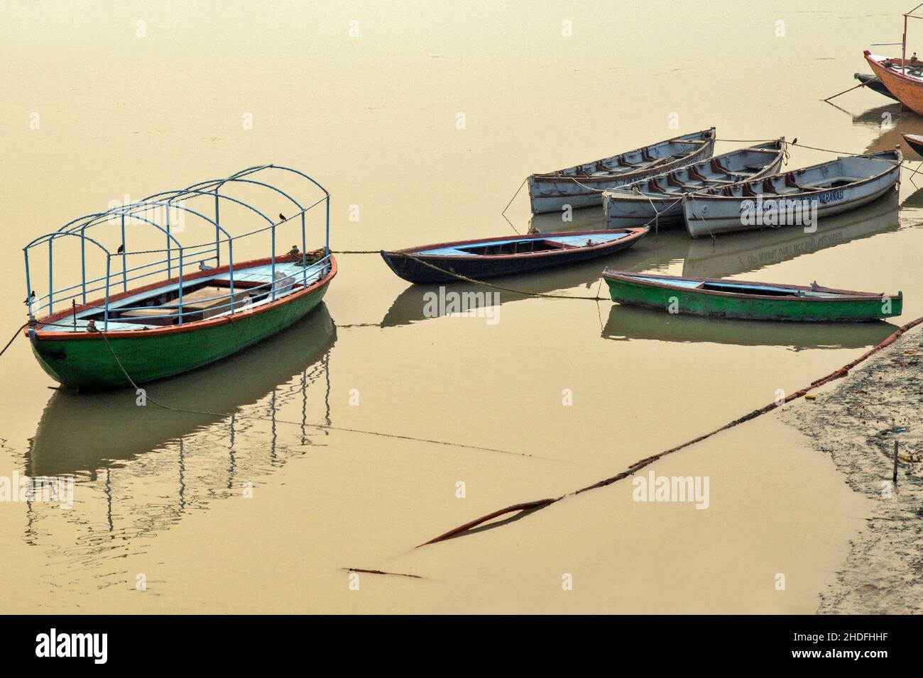 image of tourist boat reflection over ganga river at varanasi uttar pradesh india. Stock Photo