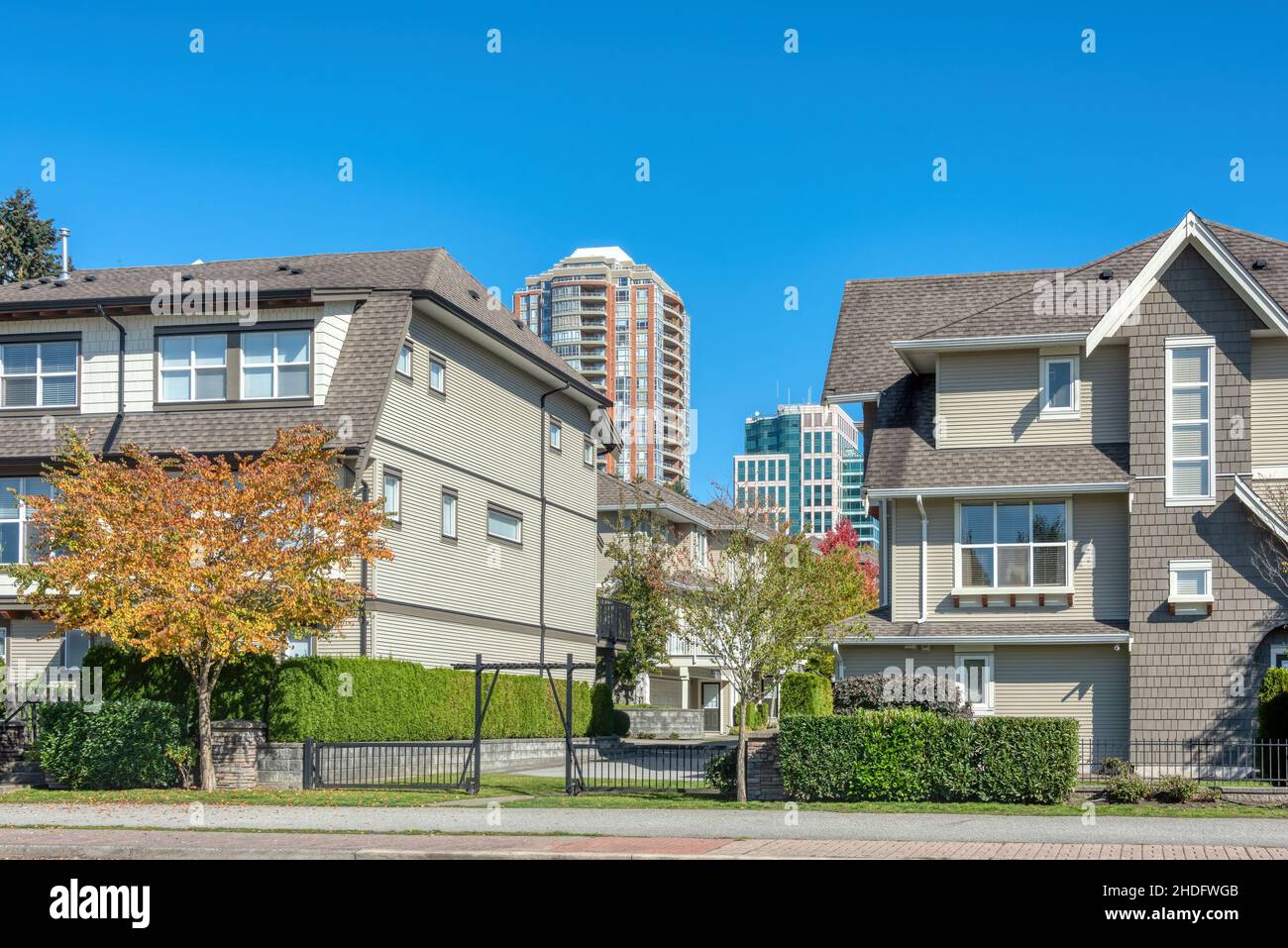 Residential apartment buildings on blue sky background Stock Photo - Alamy