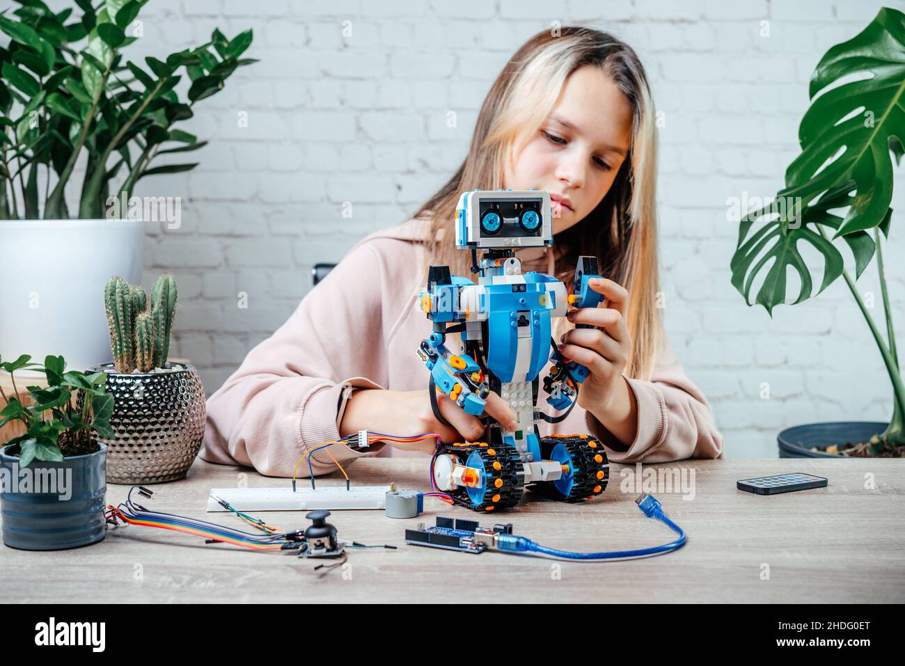 Premium Photo  Asian little boy programming code to robot machine