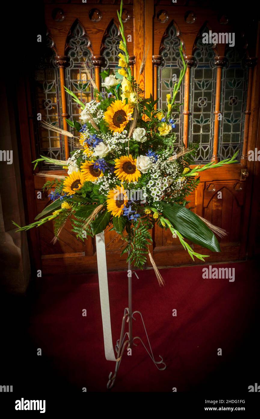 Hand crafted bridal bouquets and flowers including sunflowers and roses Stock Photo