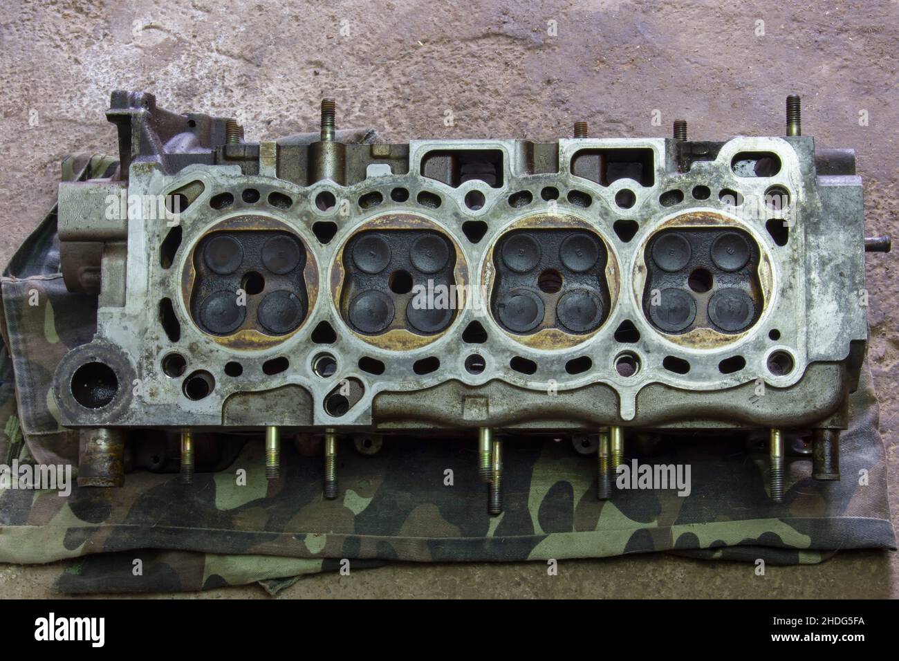The cylinder head is 16valve. Part of a car engine. Repair of the