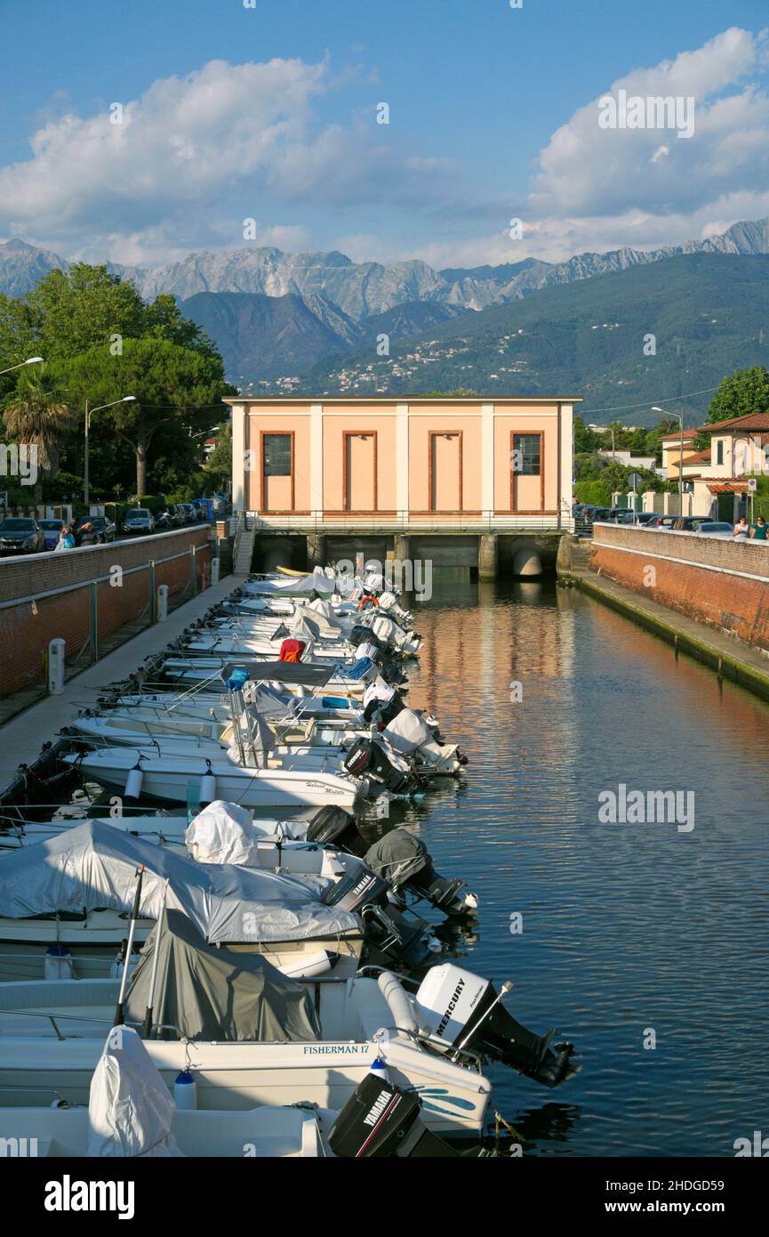 canal with moored boats in Marina di Massa, Versilia, Tuscany, Italy Stock Photo