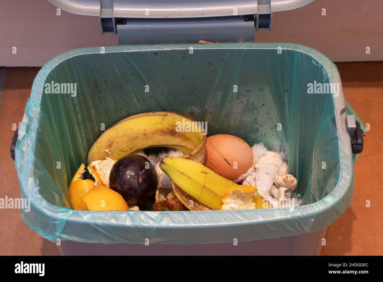 Small indoor food waste caddy for recycling via anaerobic digestion, UK. Stock Photo
