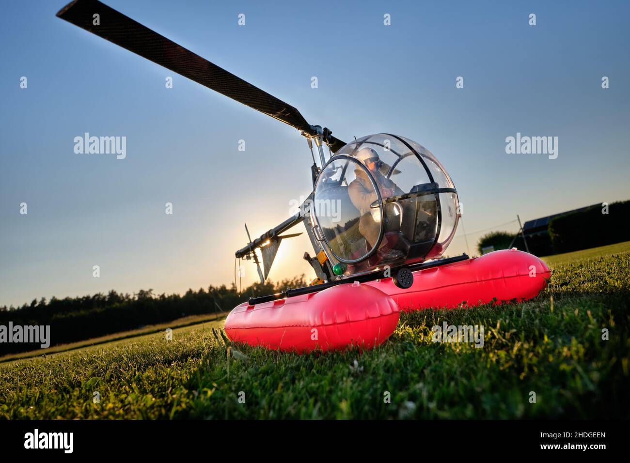 Neunhof, Germany - June 17, 2021: The Heli Baby NT of the german brand Minicopter, a radio controlled model helicopter with a pilot doll and utility f Stock Photo