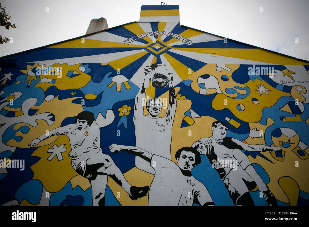 A football painted mural on the side of a house in Pudsey,west Yorkshire showing former Leeds United players including Jack Charlton on the side of a Stock Photo